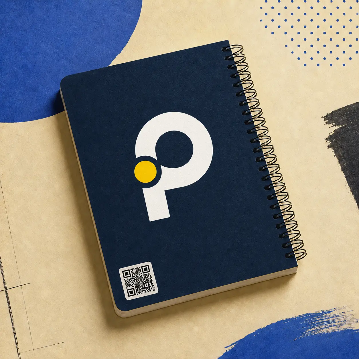 Navy Print Pulse notebook with the white and yellow logo and an integrated QR code